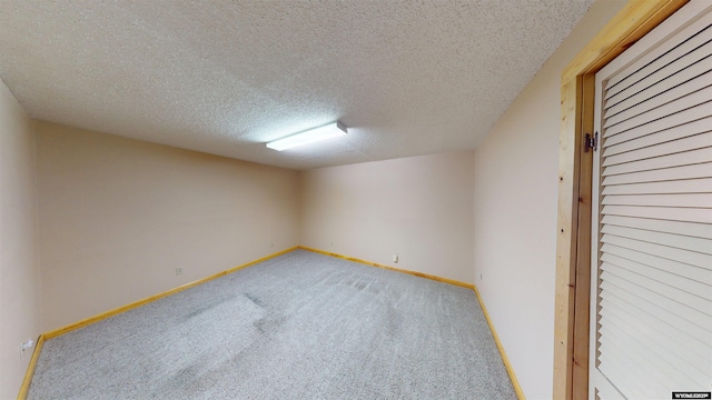 7 Raschell Ct, Lander, WY 82520 - unfurnished room with carpet, a textured ceiling, and baseboards