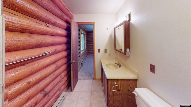 7 Raschell Ct, Lander, WY 82520 - bathroom featuring rustic walls, vanity, toilet, and tile patterned flooring