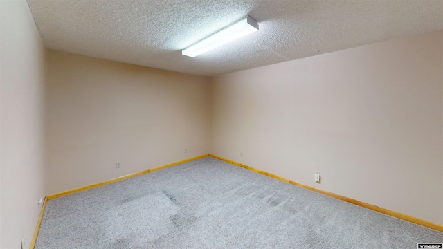 7 Raschell Ct, Lander, WY 82520 - carpeted spare room with a textured ceiling and baseboards