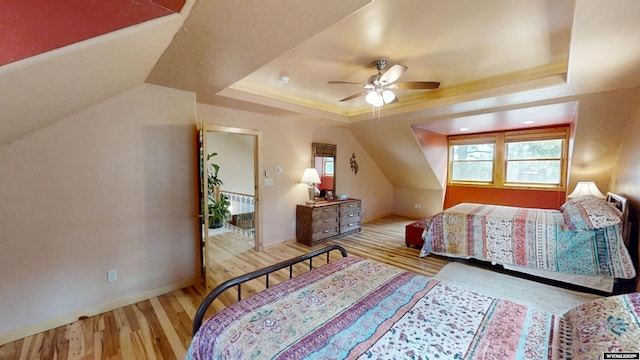 2908 Esterbrook Rd, Esterbrook, WY 82633 - bedroom with wood finished floors, a tray ceiling, baseboards, and a ceiling fan