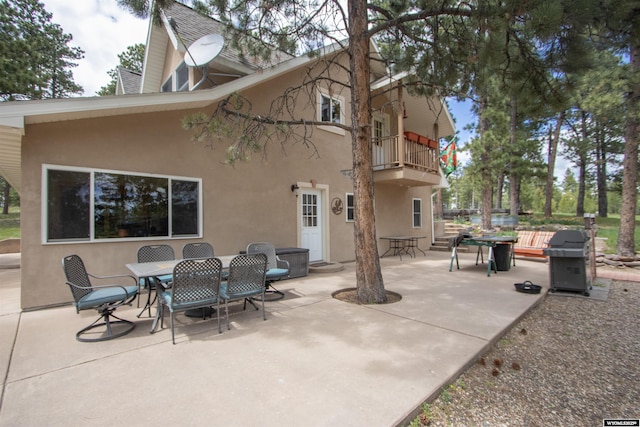 2908 Esterbrook Rd, Esterbrook, WY 82633 - view of patio featuring a balcony, a grill, and outdoor dining area