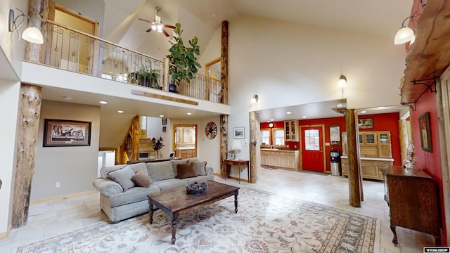 2908 Esterbrook Rd, Esterbrook, WY 82633 - living area with a ceiling fan, high vaulted ceiling, ornate columns, stairs, and recessed lighting