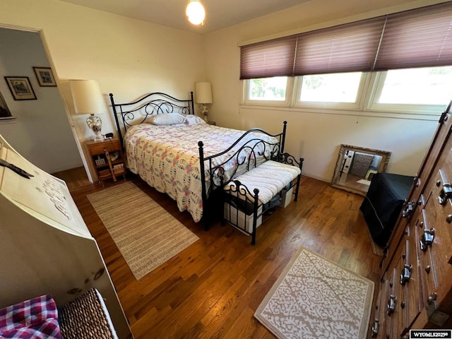 bedroom featuring wood finished floors