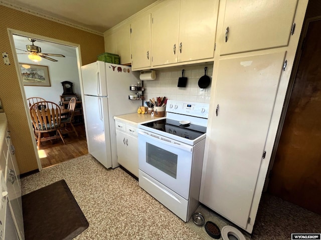 kitchen with white appliances, backsplash, ceiling fan, light countertops, and white cabinetry