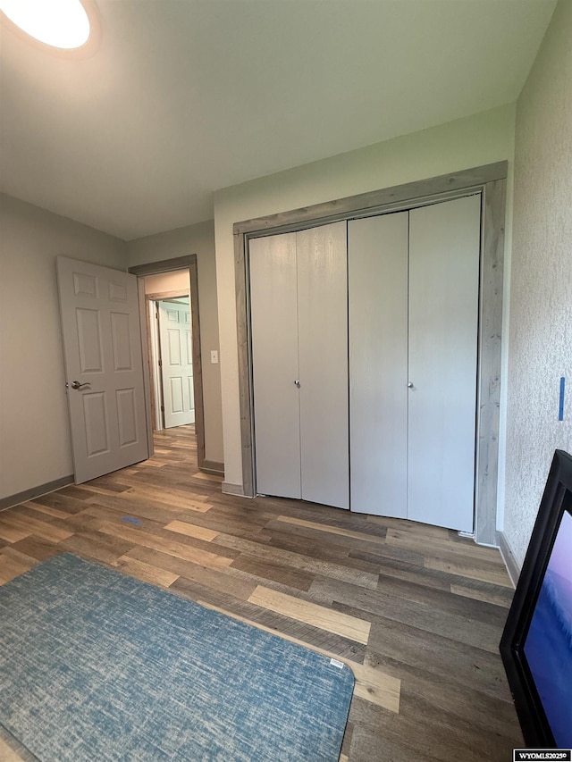 41 Ridgewater Ln, Douglas, WY 82633 - unfurnished bedroom with wood finished floors, a closet, and baseboards