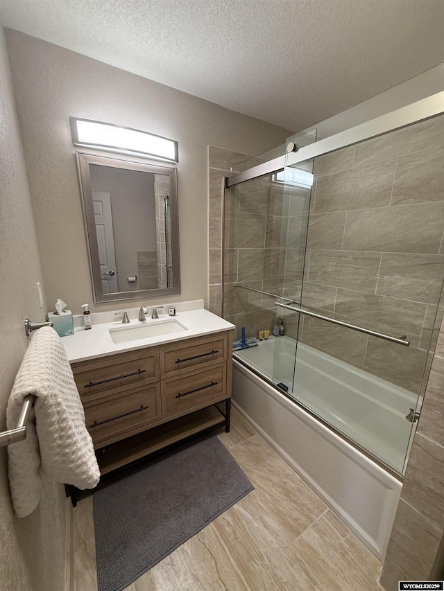 41 Ridgewater Ln, Douglas, WY 82633 - bathroom with bath / shower combo with glass door, vanity, and a textured ceiling
