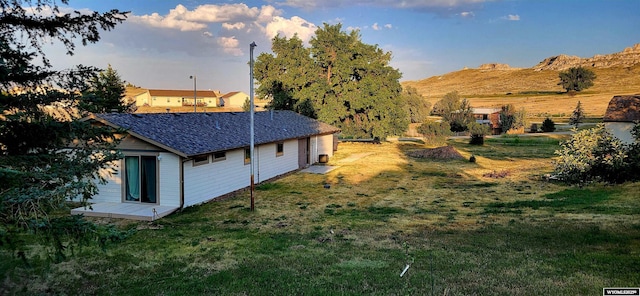 41 Ridgewater Ln, Douglas, WY 82633 - view of side of home with a yard and a mountain view