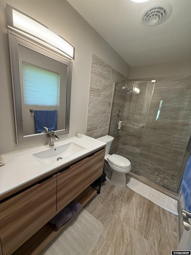 41 Ridgewater Ln, Douglas, WY 82633 - bathroom featuring a shower stall, toilet, and vanity