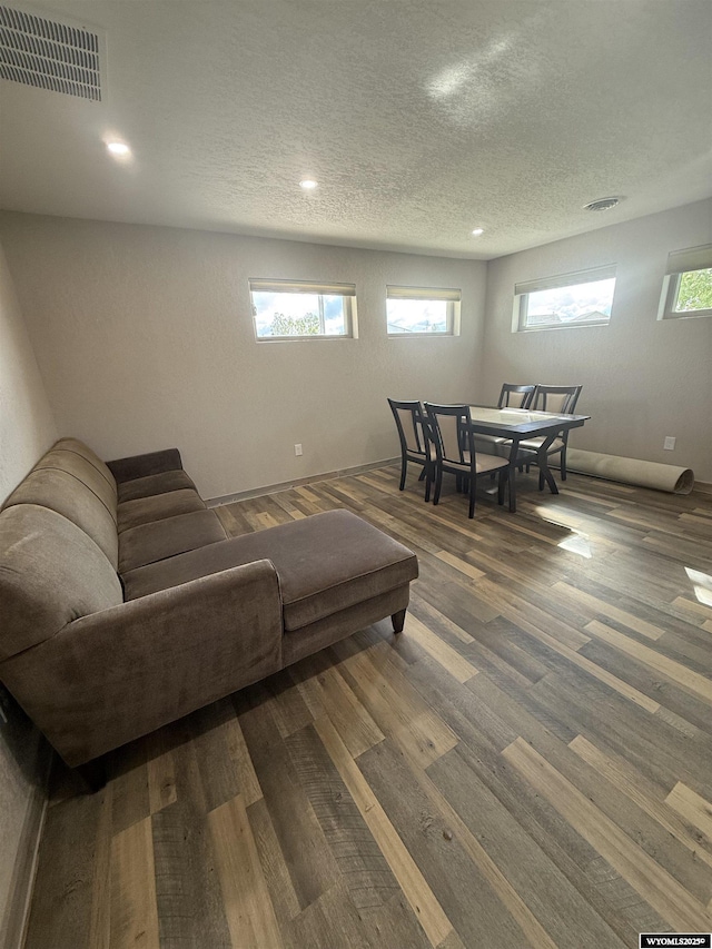 41 Ridgewater Ln, Douglas, WY 82633 - living room featuring a textured ceiling, dark wood-style flooring, and recessed lighting