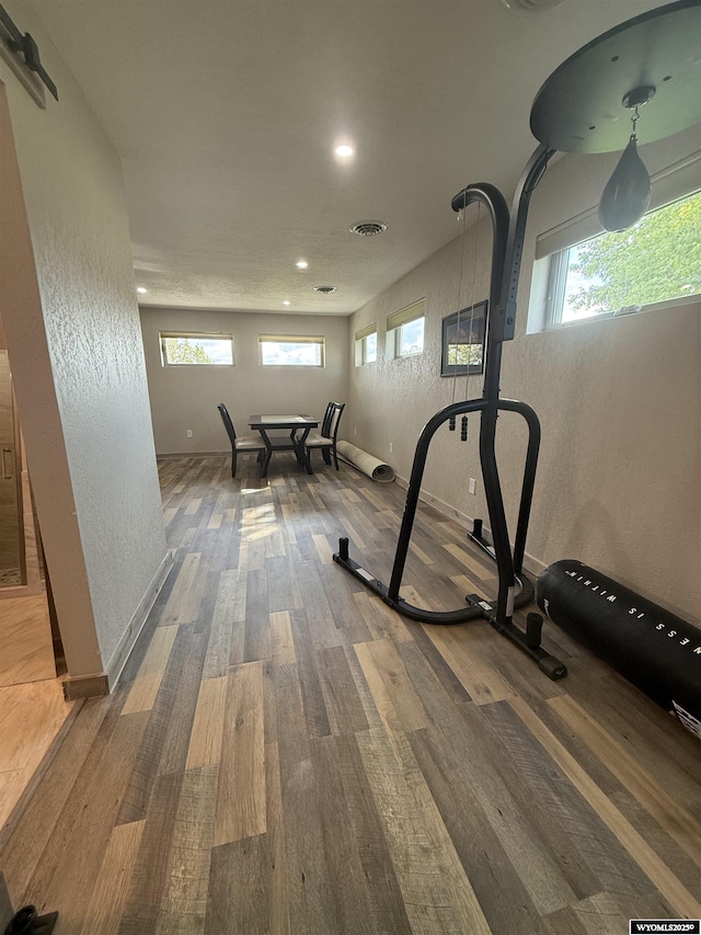 41 Ridgewater Ln, Douglas, WY 82633 - exercise area with wood finished floors, recessed lighting, a textured wall, and baseboards
