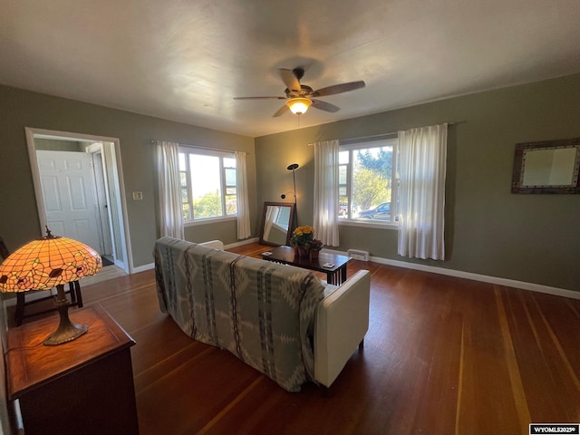 309 Cedar Ave, Kemmerer, WY 83101 - living area with plenty of natural light, dark wood-style flooring, and baseboards