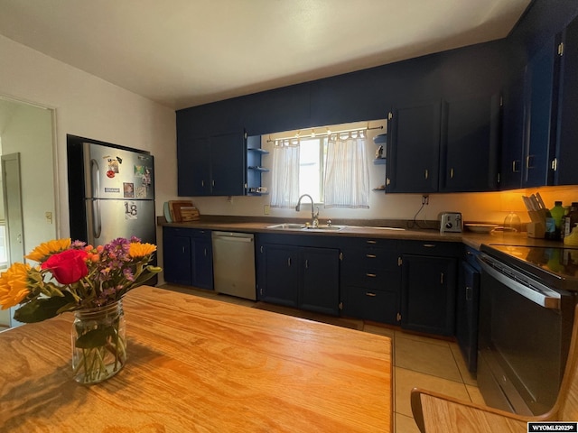 309 Cedar Ave, Kemmerer, WY 83101 - kitchen with appliances with stainless steel finishes, a sink, open shelves, and dark cabinets