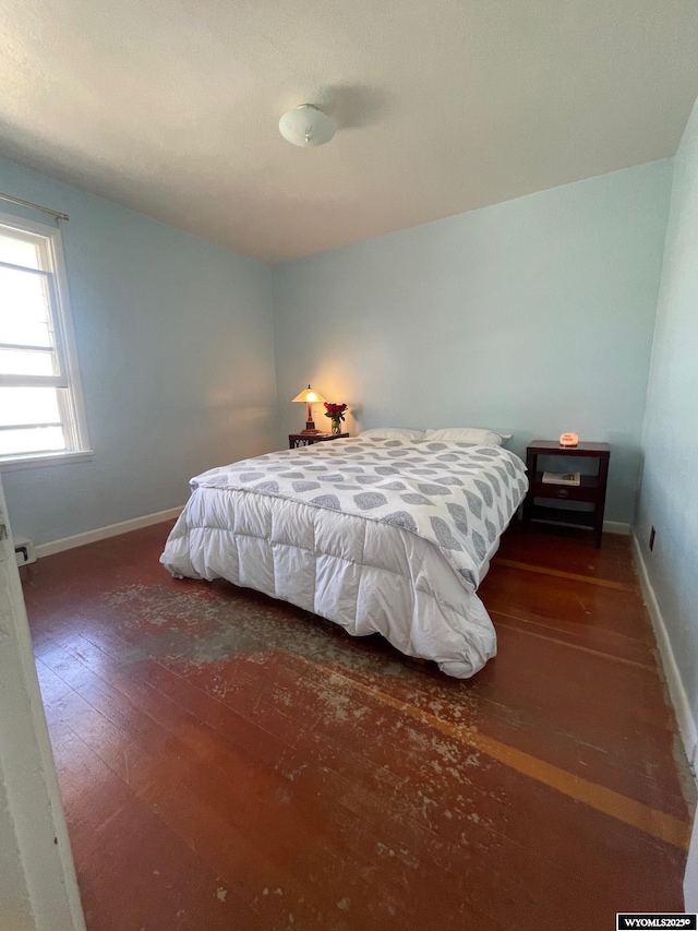 309 Cedar Ave, Kemmerer, WY 83101 - bedroom with hardwood / wood-style floors and baseboards