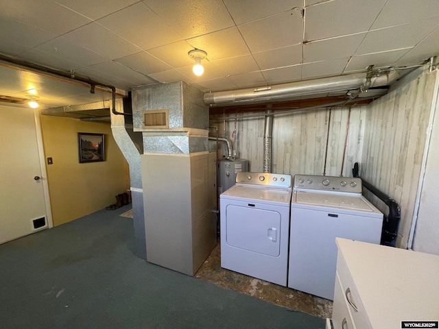 309 Cedar Ave, Kemmerer, WY 83101 - washroom featuring washer and clothes dryer and water heater