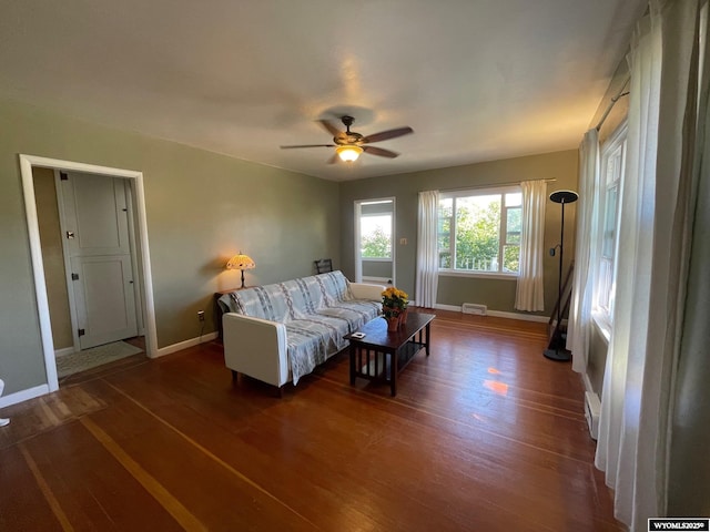 309 Cedar Ave, Kemmerer, WY 83101 - living area featuring baseboards, wood finished floors, and ceiling fan