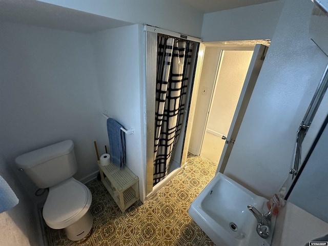 540 Smith, Lander, WY 82520 - full bathroom with toilet, tile patterned floors, and a sink