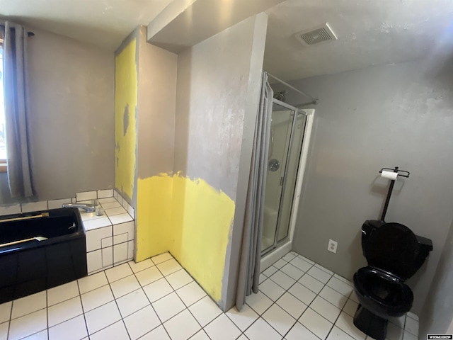 320 Turquoise Dr, Riverton, WY 82501 - full bath with a shower stall, tile patterned flooring, and a bathtub