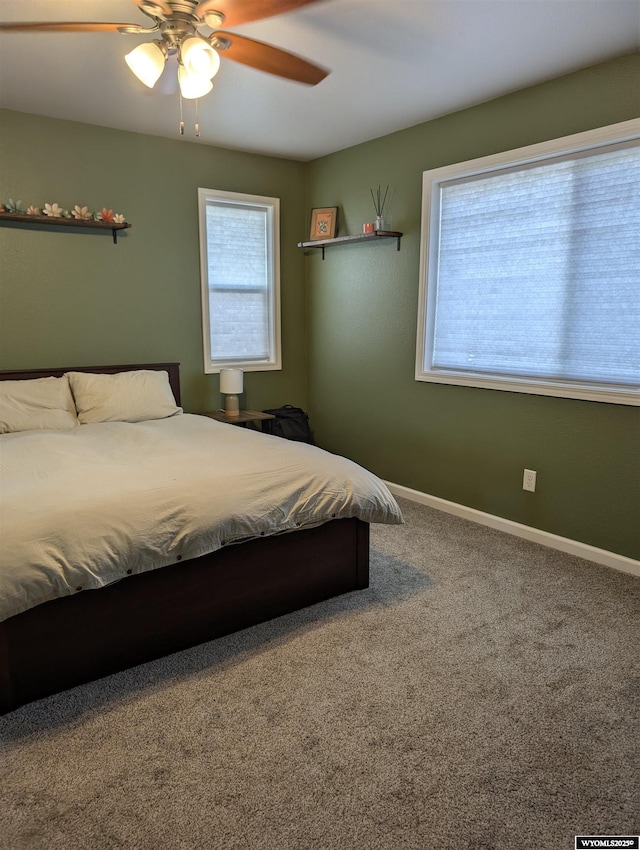 1206 E Park Ave, Riverton, WY 82501 - bedroom featuring baseboards, a ceiling fan, and carpet floors