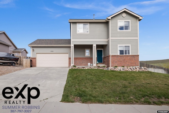2521 Sagewood Ave, Casper, WY 82601 - traditional home with brick siding, driveway, and an attached garage