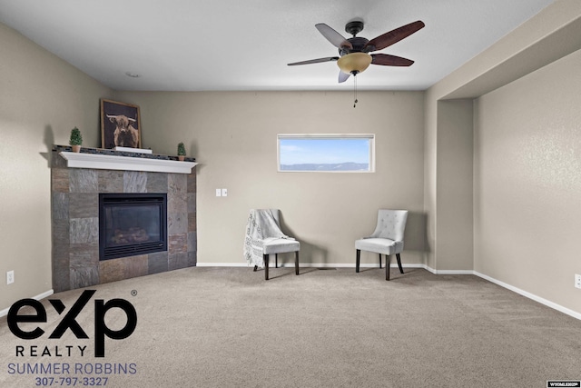 2521 Sagewood Ave, Casper, WY 82601 - sitting room featuring a tile fireplace, carpet, ceiling fan, and baseboards