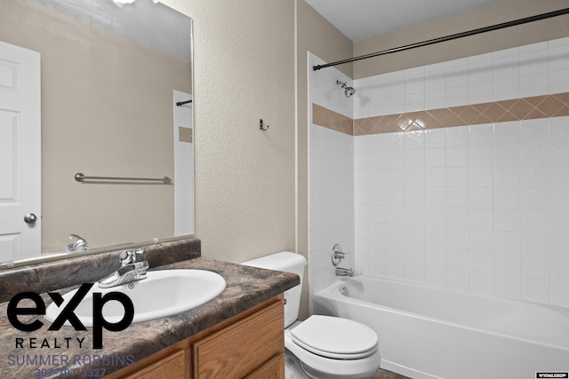 2521 Sagewood Ave, Casper, WY 82601 - bathroom featuring toilet, vanity, a textured wall, and shower / washtub combination