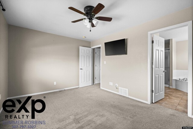 2521 Sagewood Ave, Casper, WY 82601 - unfurnished bedroom featuring carpet, baseboards, and ceiling fan