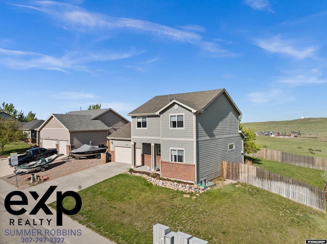 2521 Sagewood Ave, Casper, WY 82601 - traditional-style home with driveway, brick siding, and an attached garage
