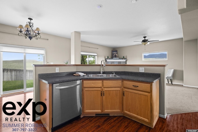 2521 Sagewood Ave, Casper, WY 82601 - kitchen featuring dishwasher, a sink, dark countertops, an island with sink, and dark wood-type flooring