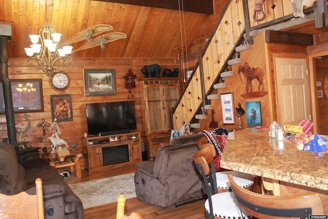 588 S Oak St, La Barge, WY 83123 - living room with wood walls, lofted ceiling, stairway, wood finished floors, and wood ceiling