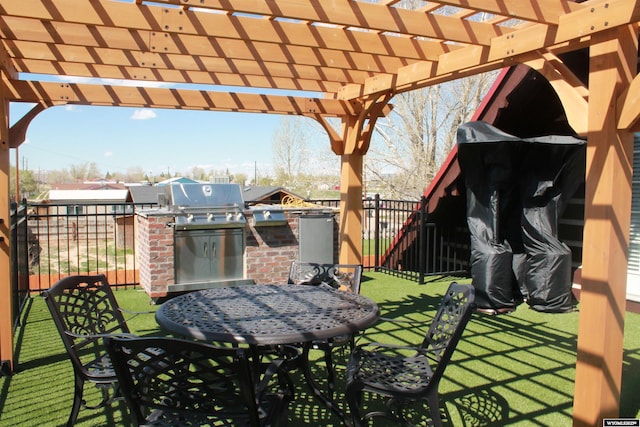 588 S Oak St, La Barge, WY 83123 - view of patio / terrace with exterior kitchen, outdoor dining area, and a pergola