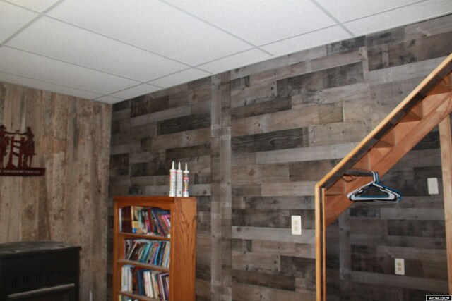 588 S Oak St, La Barge, WY 83123 - basement with wood walls and a drop ceiling