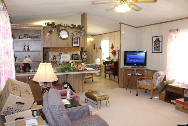SPACE10 50 S Colorado Ave, Guernsey, WY 82214 - living room featuring ceiling fan, lofted ceiling, carpet floors, crown molding, and wood walls