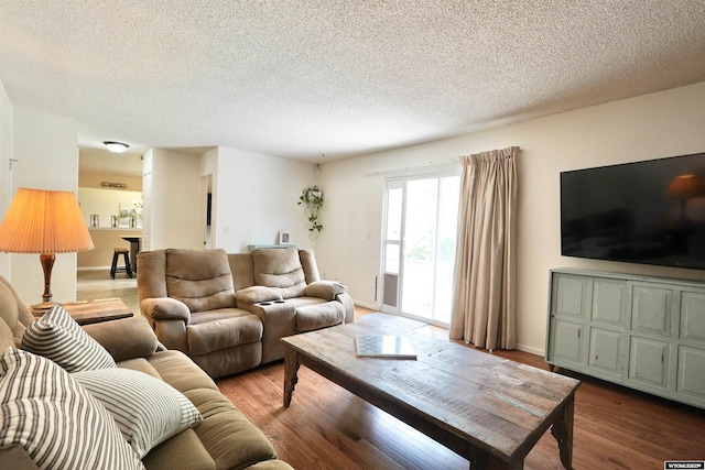 4451 S David St, Casper, WY 82601 - living area featuring wood finished floors and a textured ceiling