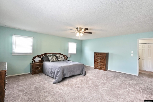 4451 S David St, Casper, WY 82601 - bedroom with carpet floors, a textured ceiling, baseboards, and ceiling fan