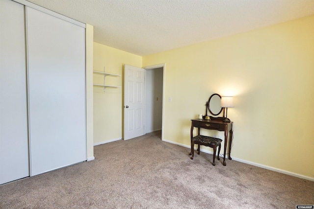 4451 S David St, Casper, WY 82601 - bedroom featuring carpet floors, a closet, baseboards, and a textured ceiling