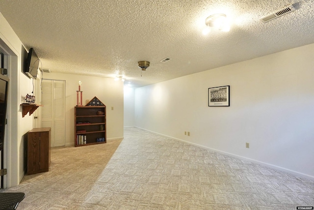4451 S David St, Casper, WY 82601 - spare room featuring light colored carpet, a textured ceiling, and baseboards