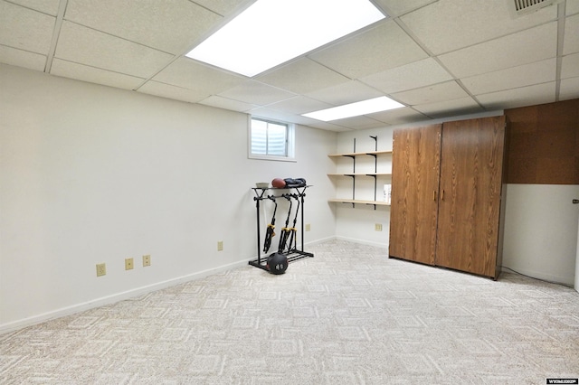 4451 S David St, Casper, WY 82601 - below grade area with a paneled ceiling, light carpet, and baseboards
