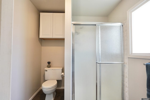 4451 S David St, Casper, WY 82601 - full bathroom featuring a stall shower and toilet