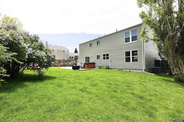 4451 S David St, Casper, WY 82601 - rear view of property featuring a yard and a patio area