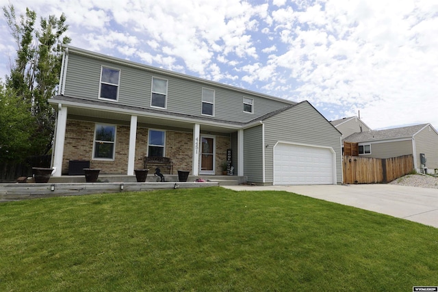 4451 S David St, Casper, WY 82601 - view of front of property with concrete driveway, a garage, brick siding, and a porch