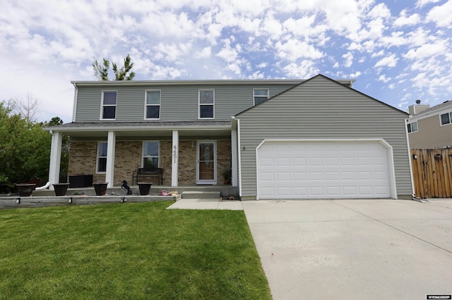 4451 S David St, Casper, WY 82601 - view of front of property featuring concrete driveway, a garage, a porch, and brick siding