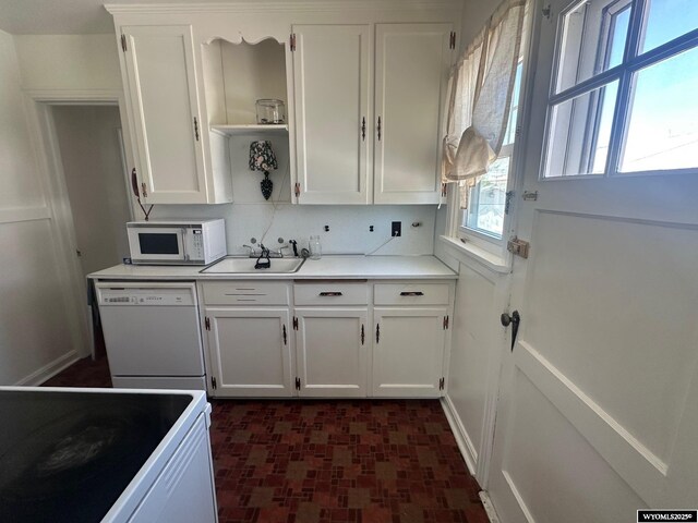 101 9th, Sinclair, WY 82334 - kitchen featuring white appliances, open shelves, a sink, and white cabinets