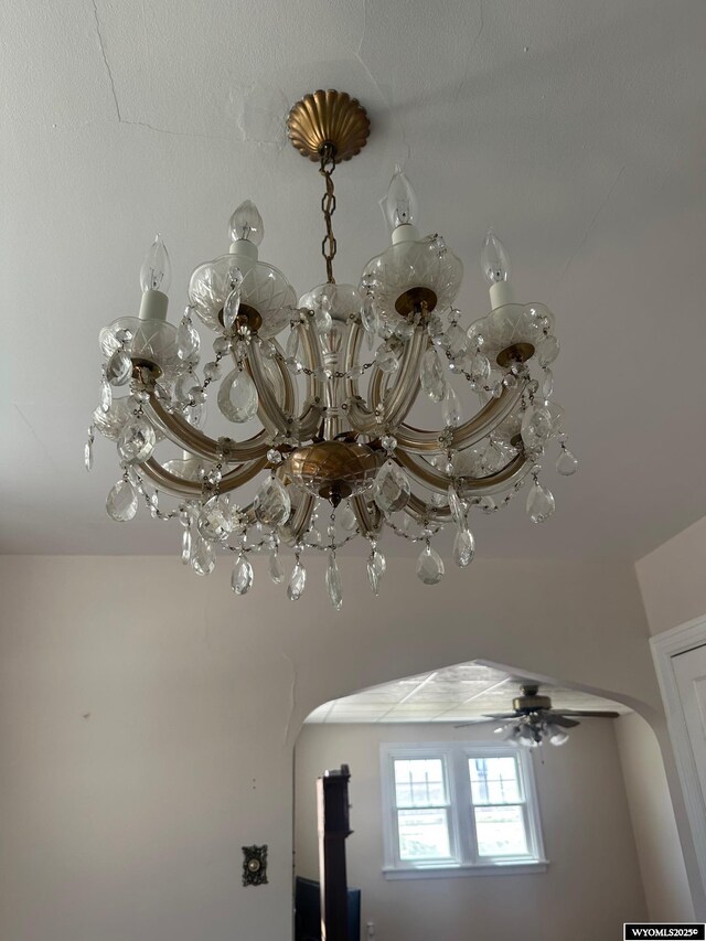 101 9th, Sinclair, WY 82334 - detailed view of arched walkways, ceiling fan, and a chandelier