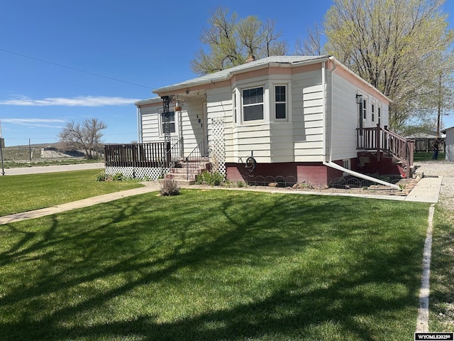 101 9th, Sinclair, WY 82334 - view of front of house featuring a front yard and covered porch