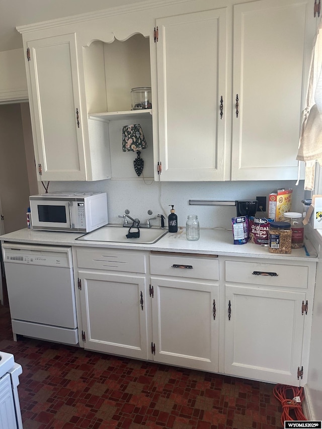 101 9th, Sinclair, WY 82334 - kitchen with white appliances, a sink, white cabinets, light countertops, and open shelves