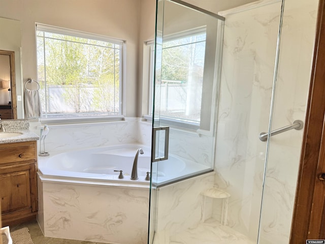 617 Lucille Cir, Evanston, WY 82930 - bathroom with vanity, a garden tub, and a marble finish shower