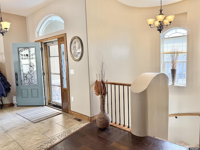 617 Lucille Cir, Evanston, WY 82930 - foyer with a chandelier, wood finished floors, and baseboards