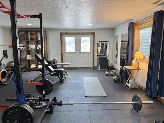 617 Lucille Cir, Evanston, WY 82930 - exercise room featuring a textured ceiling, healthy amount of natural light, french doors, and recessed lighting
