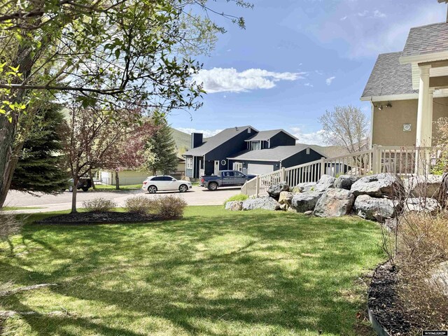 617 Lucille Cir, Evanston, WY 82930 - view of green lawn with a residential view