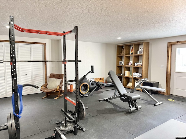 617 Lucille Cir, Evanston, WY 82930 - exercise room featuring a textured ceiling